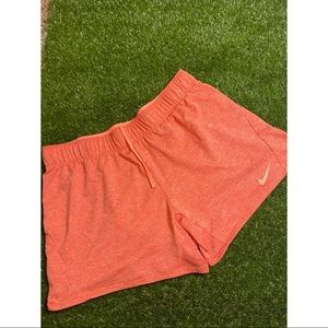 peach colored Nike shorts